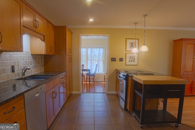 kitchen with a sink, stainless steel range with electric cooktop, brown cabinets, dishwasher, and crown molding