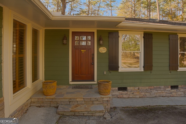 doorway to property featuring crawl space