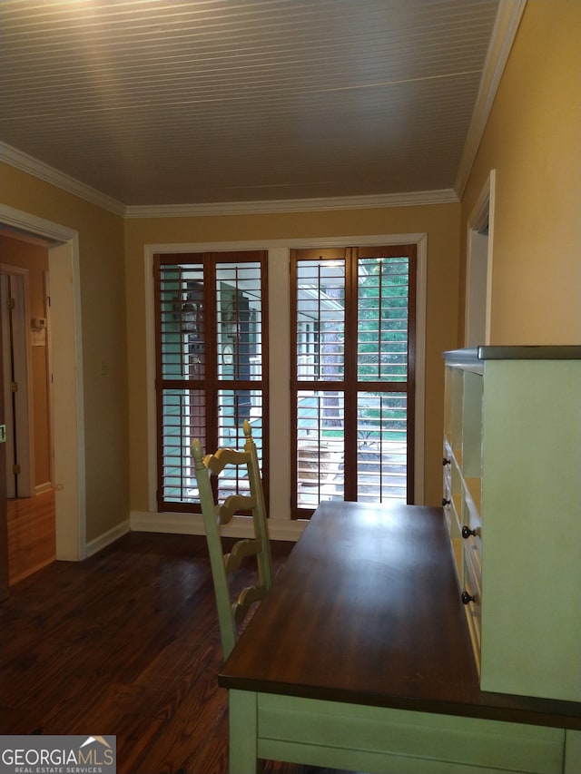 unfurnished dining area featuring crown molding and dark hardwood / wood-style flooring