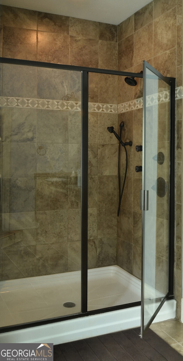 bathroom with an enclosed shower