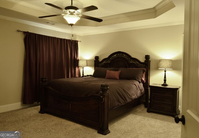 bedroom with light carpet, ceiling fan, a raised ceiling, and ornamental molding