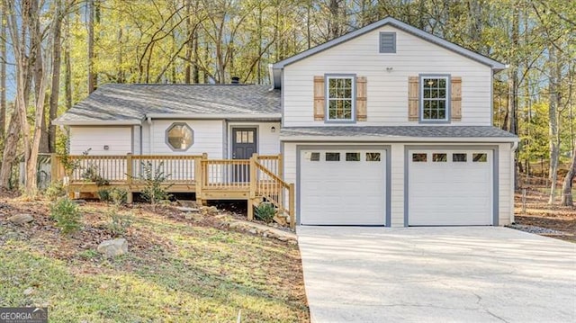 view of front of house featuring a garage and a wooden deck