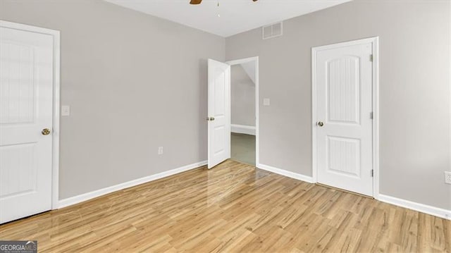 unfurnished bedroom featuring ceiling fan and light hardwood / wood-style flooring