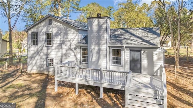 back of property with a wooden deck