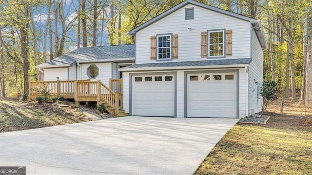 view of front of property with a garage and a deck