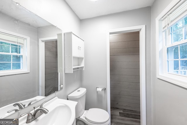 half bath featuring a sink and toilet