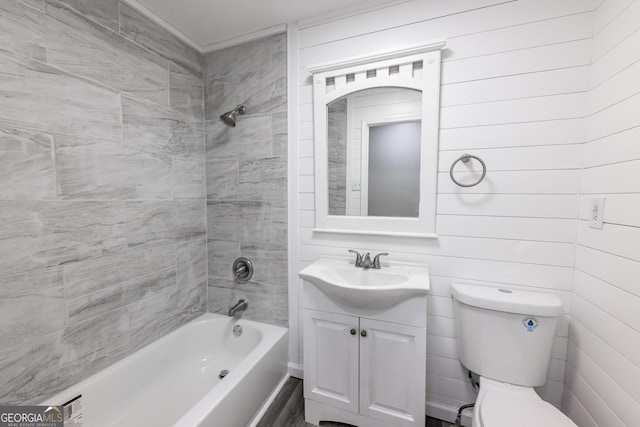 bathroom with toilet, shower / tub combination, and vanity