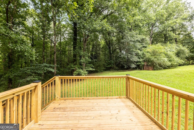 wooden deck with a yard