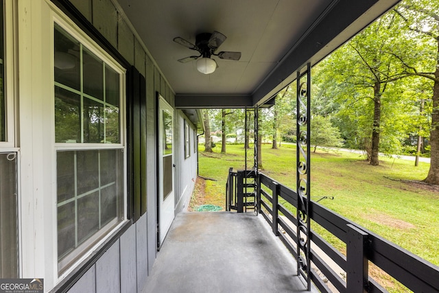 view of patio with ceiling fan and a porch