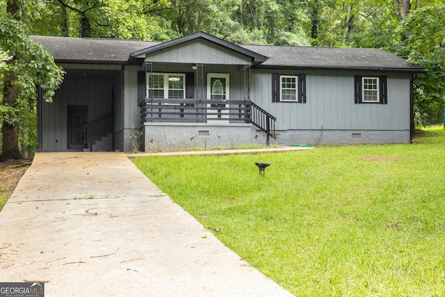 single story home featuring a shingled roof, concrete driveway, crawl space, an attached carport, and a front lawn