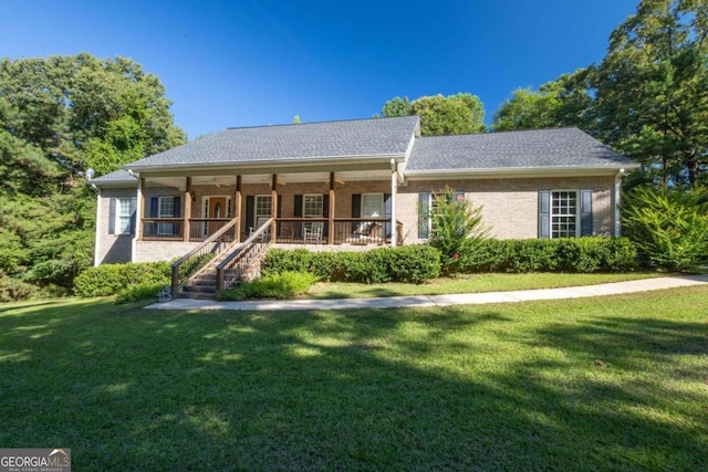 view of front of property featuring a porch and a front yard