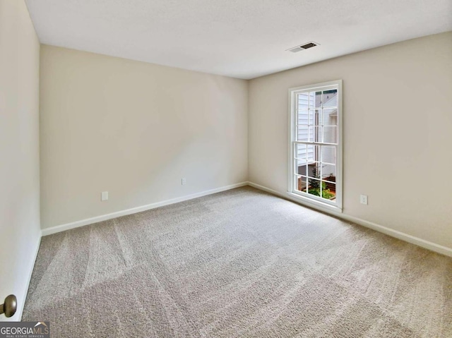 view of carpeted spare room