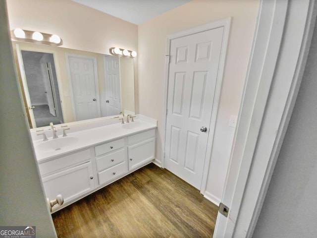 bathroom with hardwood / wood-style flooring and vanity