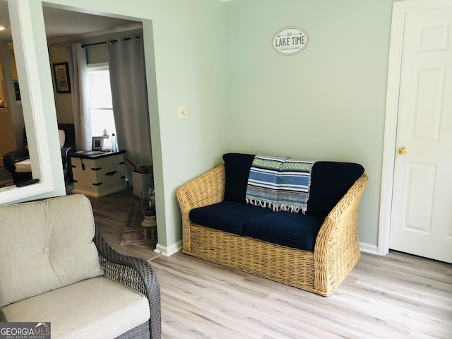 sitting room featuring light hardwood / wood-style flooring