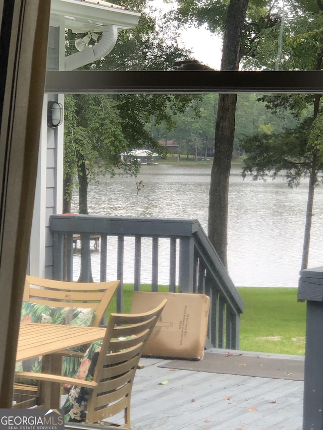 wooden terrace with a water view