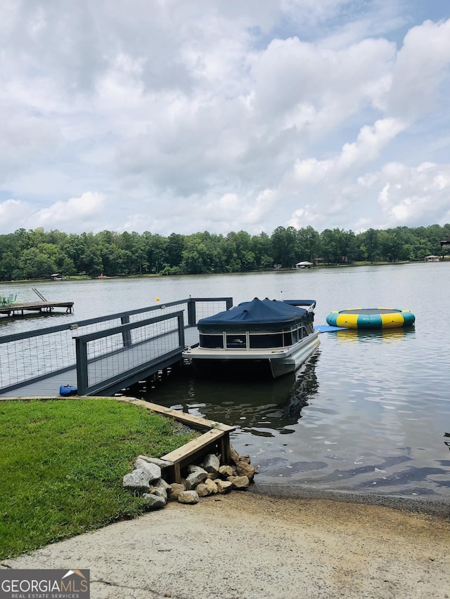 dock area featuring a water view