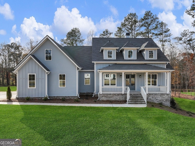 216 Ewing Way, Dacula, GA 30019 - modern inspired farmhouse featuring board and batten siding, a porch, roof with shingles, and a front lawn