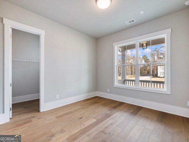 unfurnished room featuring light wood-type flooring