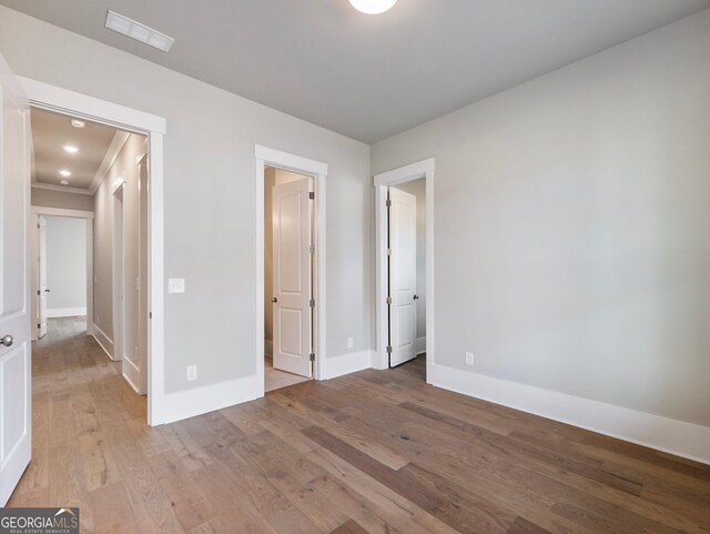 unfurnished bedroom with light wood-type flooring