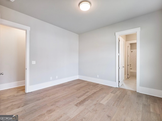 216 Ewing Way, Dacula, GA 30019 - unfurnished room with light wood finished floors and baseboards