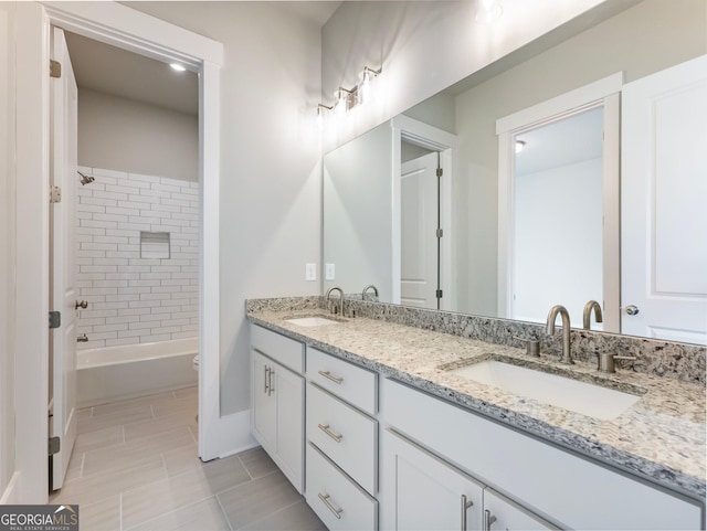 216 Ewing Way, Dacula, GA 30019 - bathroom with double vanity, tub / shower combination, and tile patterned floors