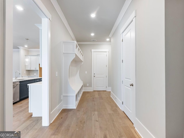 216 Ewing Way, Dacula, GA 30019 - mudroom featuring crown molding, light wood-style floors, and recessed lighting