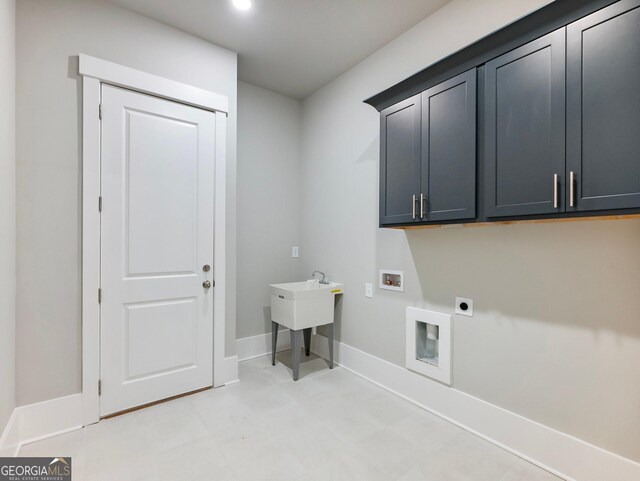 laundry room with hookup for an electric dryer, cabinets, and washer hookup