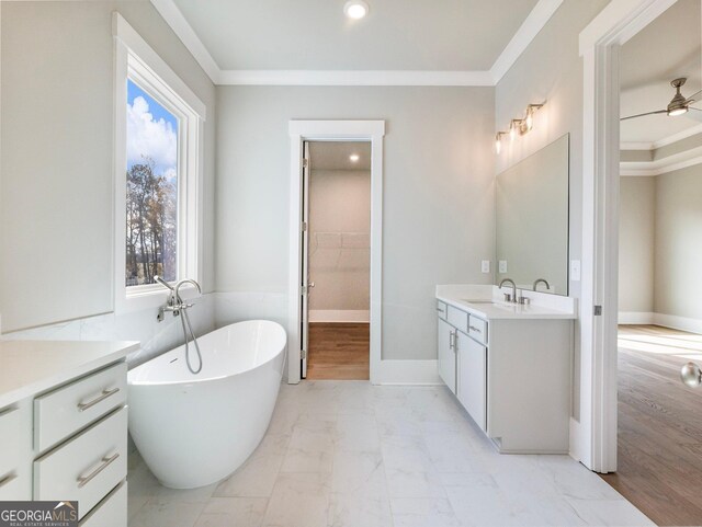 bathroom featuring a washtub, vanity, ceiling fan, crown molding, and hardwood / wood-style floors