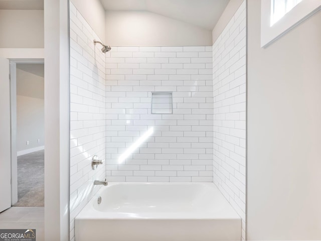 216 Ewing Way, Dacula, GA 30019 - full bathroom featuring washtub / shower combination and lofted ceiling
