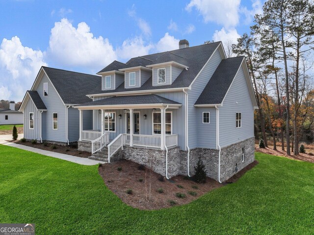 view of front of house featuring a front yard and a porch