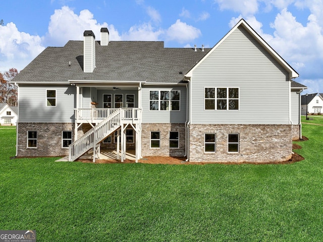 216 Ewing Way, Dacula, GA 30019 - rear view of property featuring brick siding, a ceiling fan, stairs, and a yard