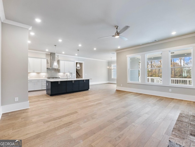 216 Ewing Way, Dacula, GA 30019 - unfurnished living room featuring crown molding, a ceiling fan, light wood-style flooring, and recessed lighting