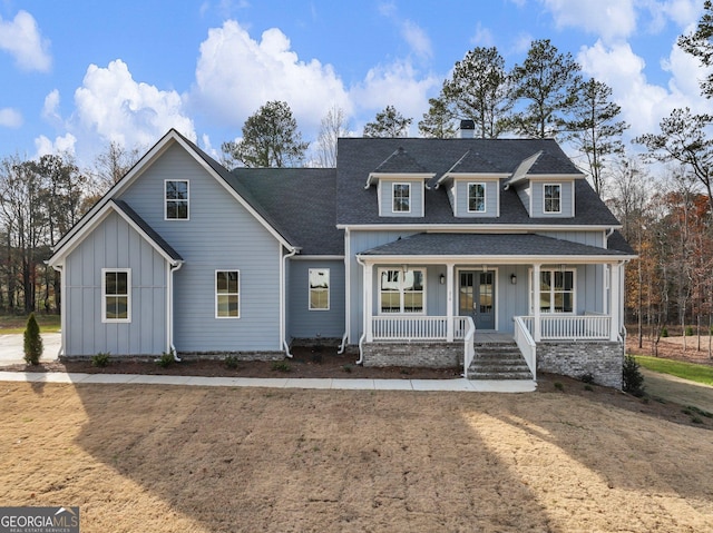 216 Ewing Way, Dacula, GA 30019 - modern farmhouse style home with board and batten siding, a porch, a shingled roof, a chimney, and french doors
