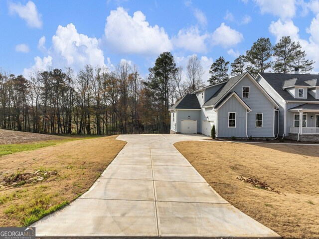 view of front of house with a garage and a front yard