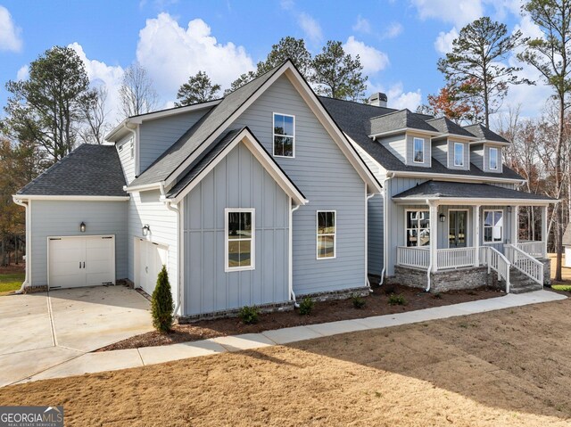 view of front of house with a garage and covered porch