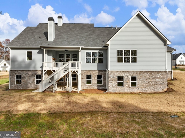 216 Ewing Way, Dacula, GA 30019 - rear view of house featuring ceiling fan, brick siding, stairs, a chimney, and a yard