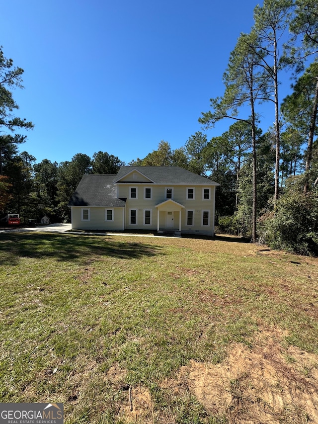 view of front of house with a front lawn