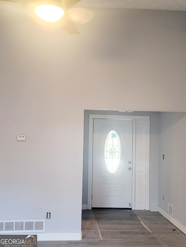 entryway with dark hardwood / wood-style floors