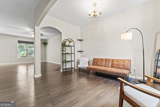 living area with wood-type flooring and a chandelier