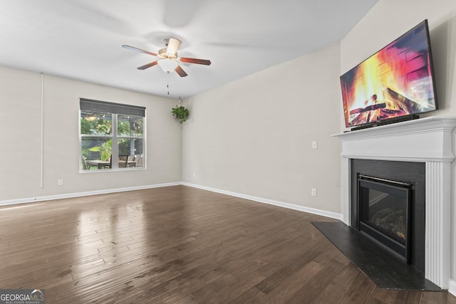 living area featuring ceiling fan with notable chandelier and wood-type flooring