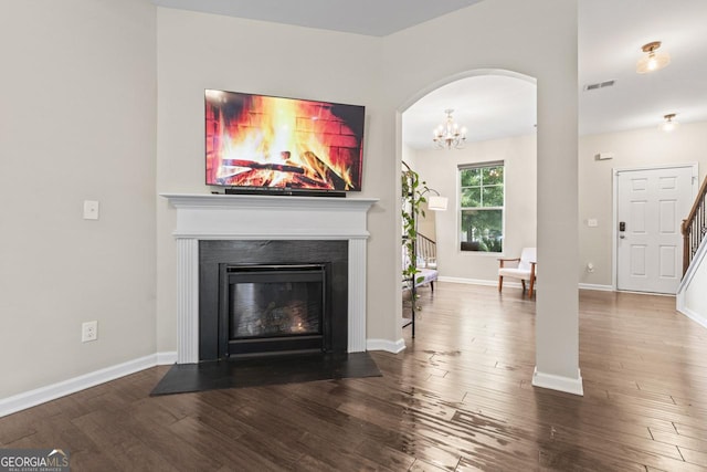 unfurnished living room with hardwood / wood-style floors and ceiling fan