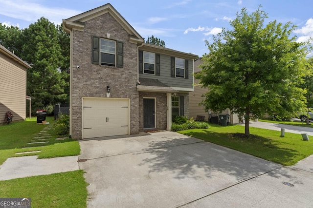 view of front of property featuring a garage and a front yard