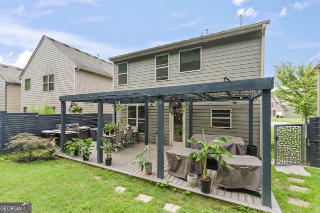 back of property featuring a pergola and a wooden deck