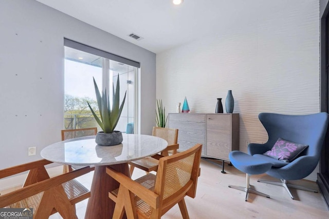 dining area with light hardwood / wood-style floors