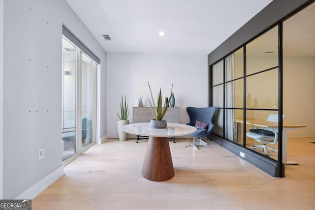 sitting room with hardwood / wood-style floors