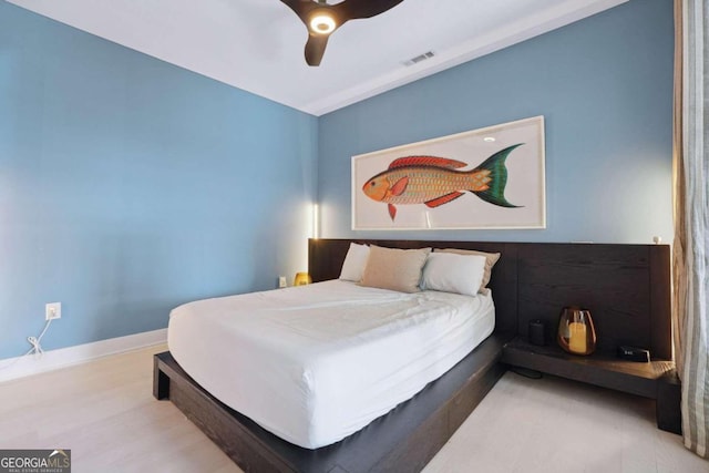 bedroom featuring light wood-type flooring and ceiling fan