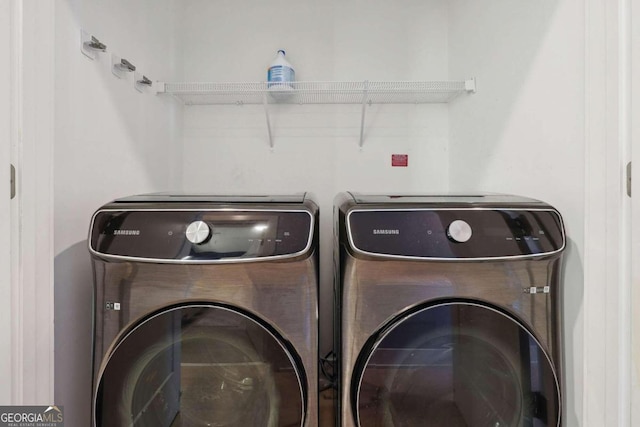 washroom featuring independent washer and dryer