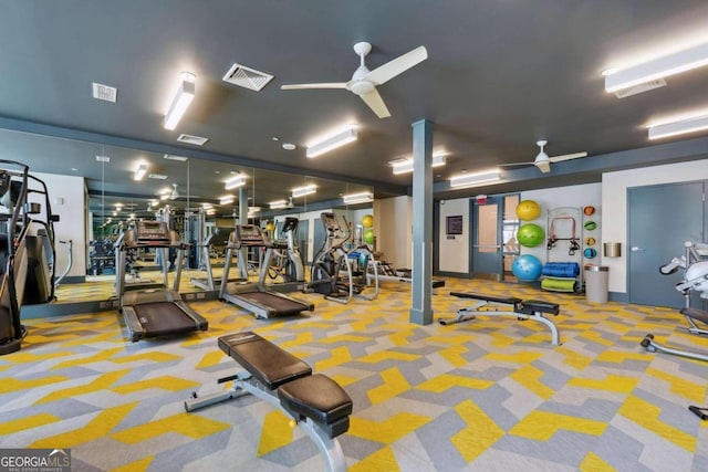 workout area with ceiling fan and light colored carpet