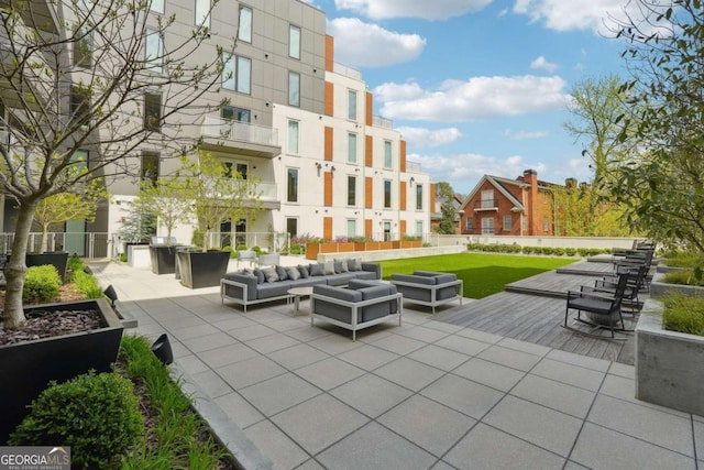 view of patio with a balcony and outdoor lounge area