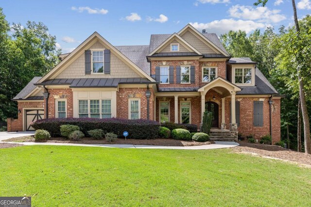 craftsman-style house with a garage and a front yard